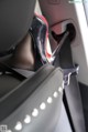 A close up of a woman's legs in a car seat.